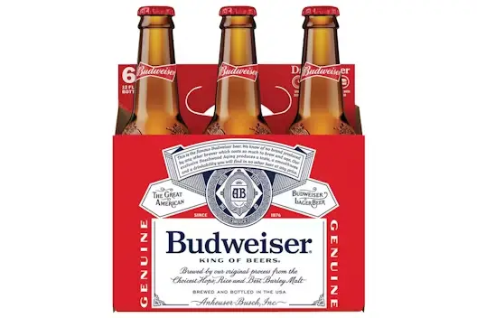 Six-pack of Budweiser beer bottles in branded red packaging, displayed upright against a white background.