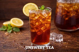 Unsweetened iced tea served over ice with lemon slice and mint, refreshing zero-sugar tea beverage