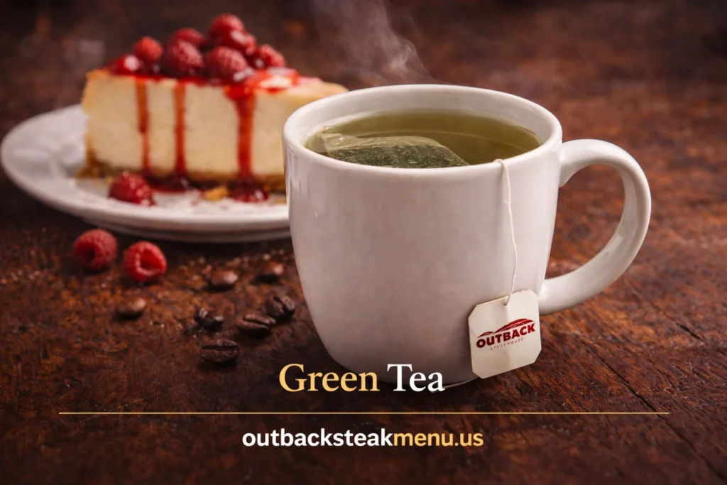 Green tea served with New York style cheesecake from Outback Desserts Menu topped with raspberry sauce and fresh berries